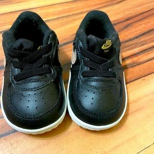 Black and gold size 4 Nike Air Force 1s